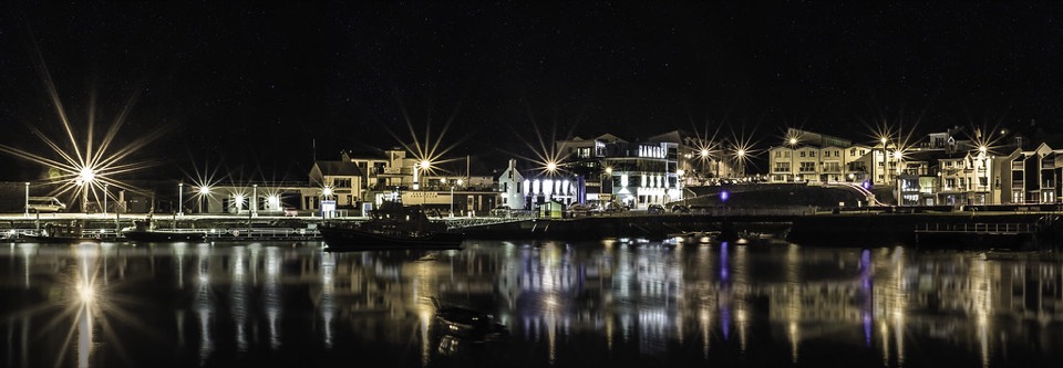 Portrush harbour on the County Antrim coast, lit up after dark
